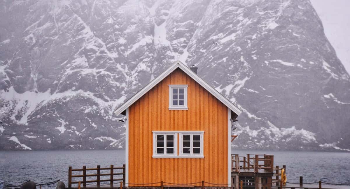 Lofoten yellow house by the mountain