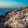 Santorini cliff houses at sunset time