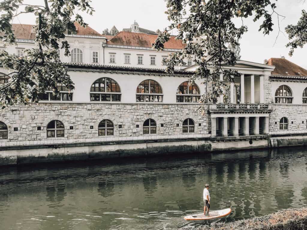 slovenia 5-day itinerary for first time travellers. Man on a boat in canal