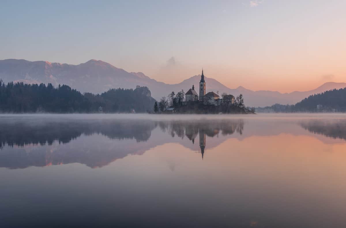 sunset over lake in slovenia