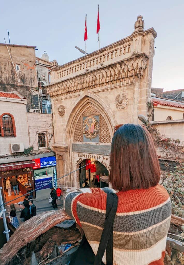 girl looking over the grand bazaar from a rooftop
