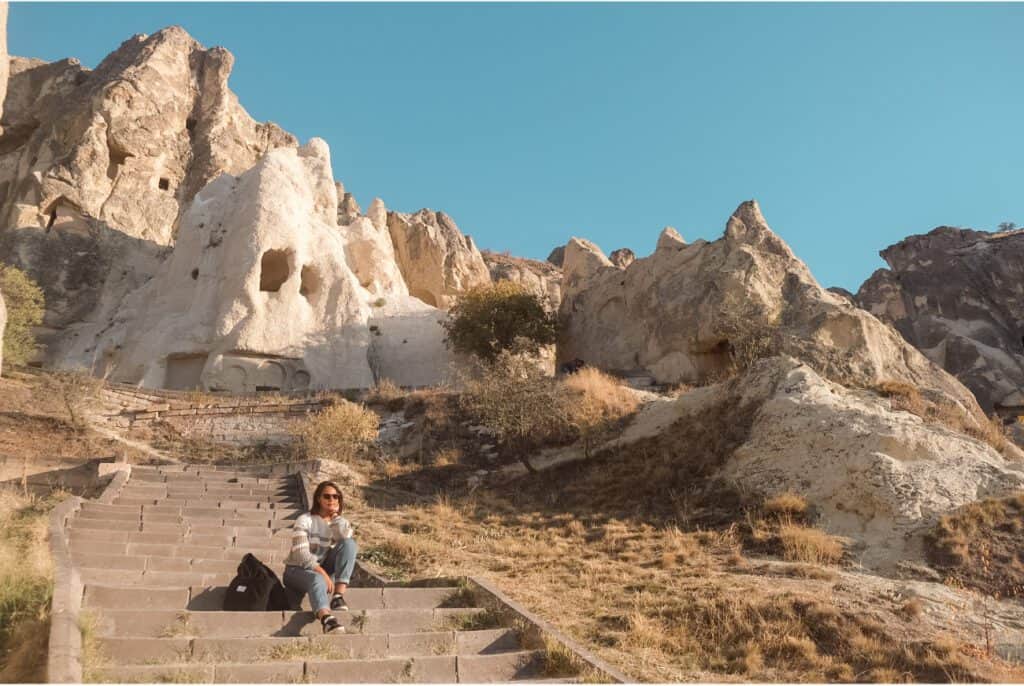 Girl sitting in old archeological site in Cappadocia
