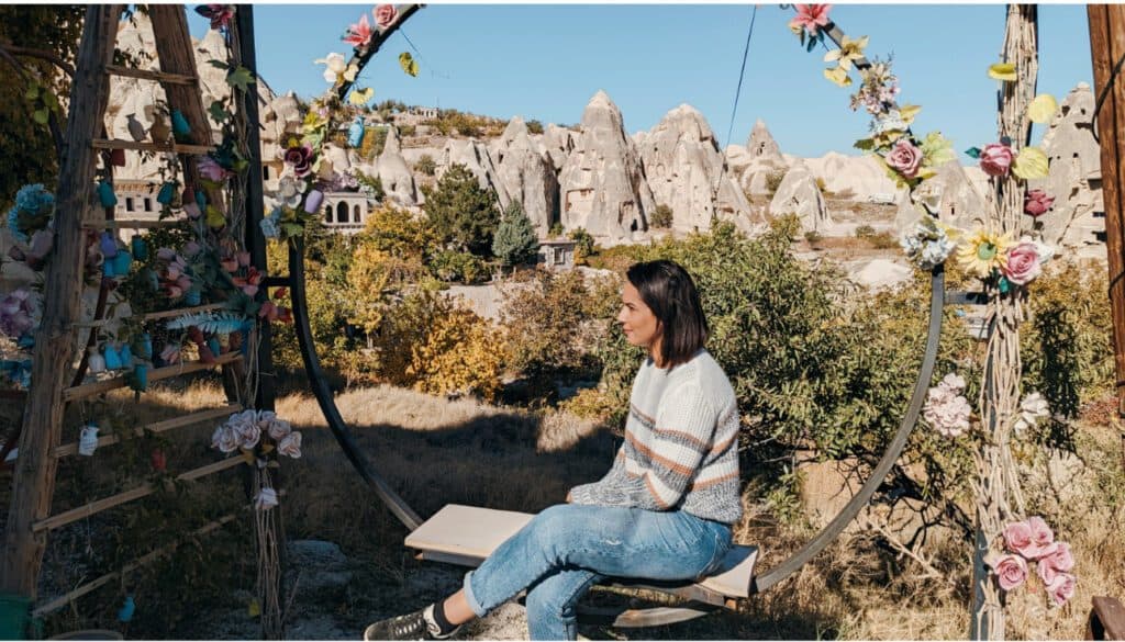 girl sitting on a flowers swing in Cappadocia