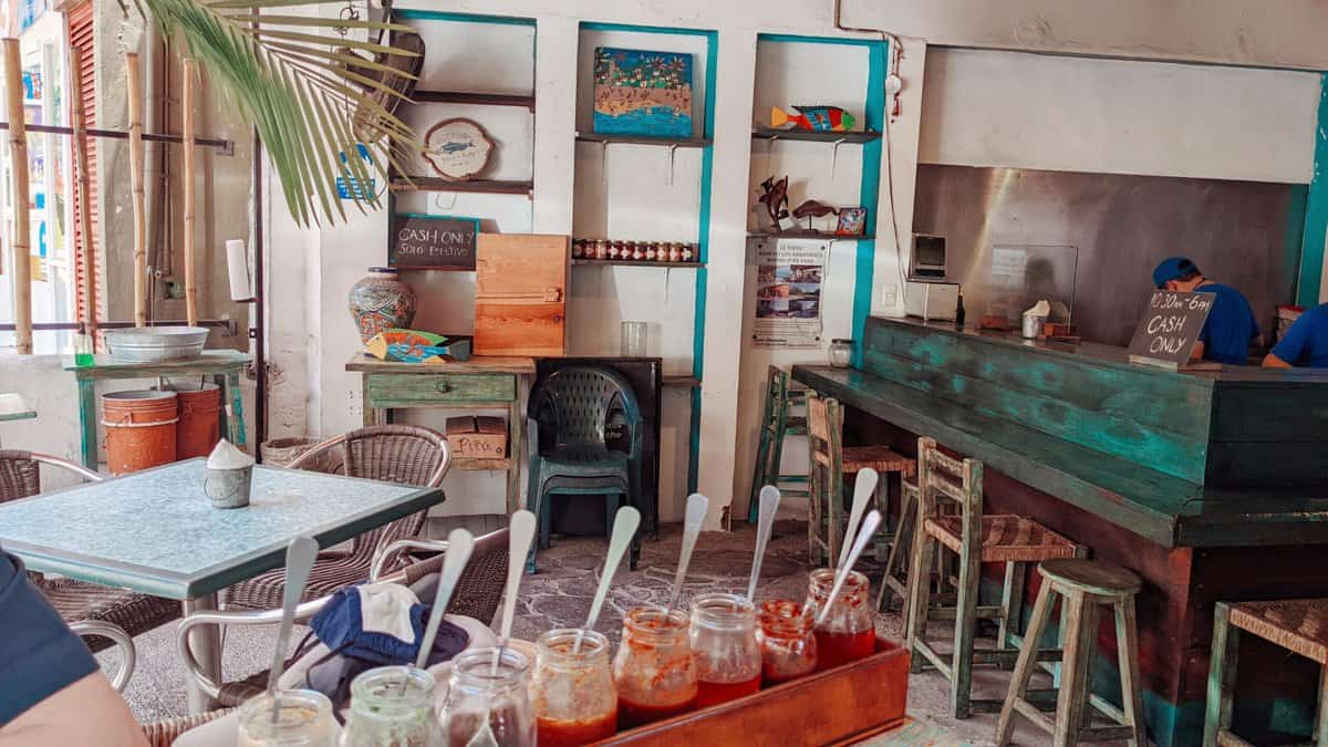 Typical Mexican restaurant, featuring tables and chairs, mexican decor and food