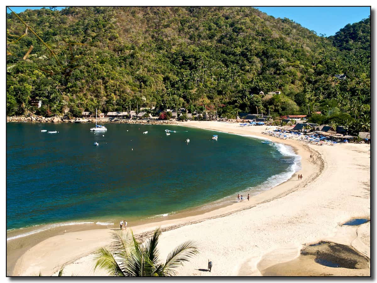 Beautiful island with crystal clar green water and surrounded by forests