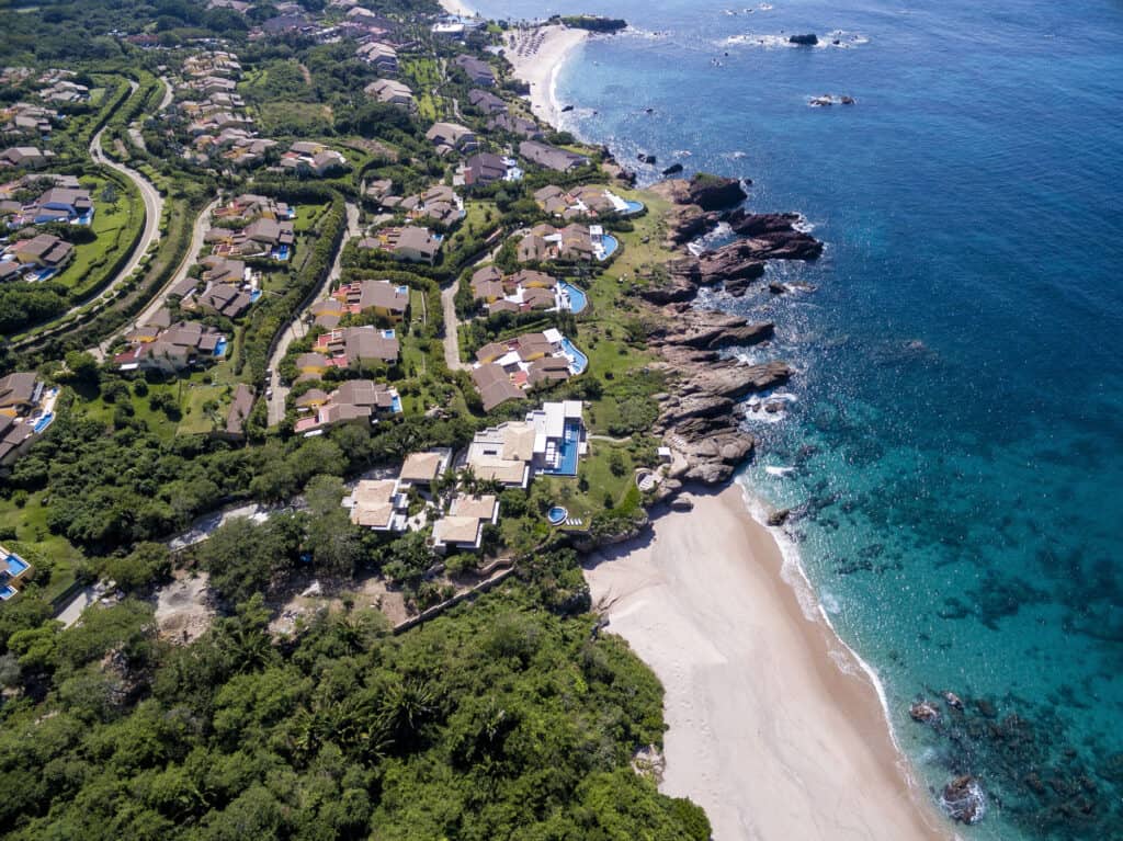 Blue ocean and flat buildings in Punta de Mita