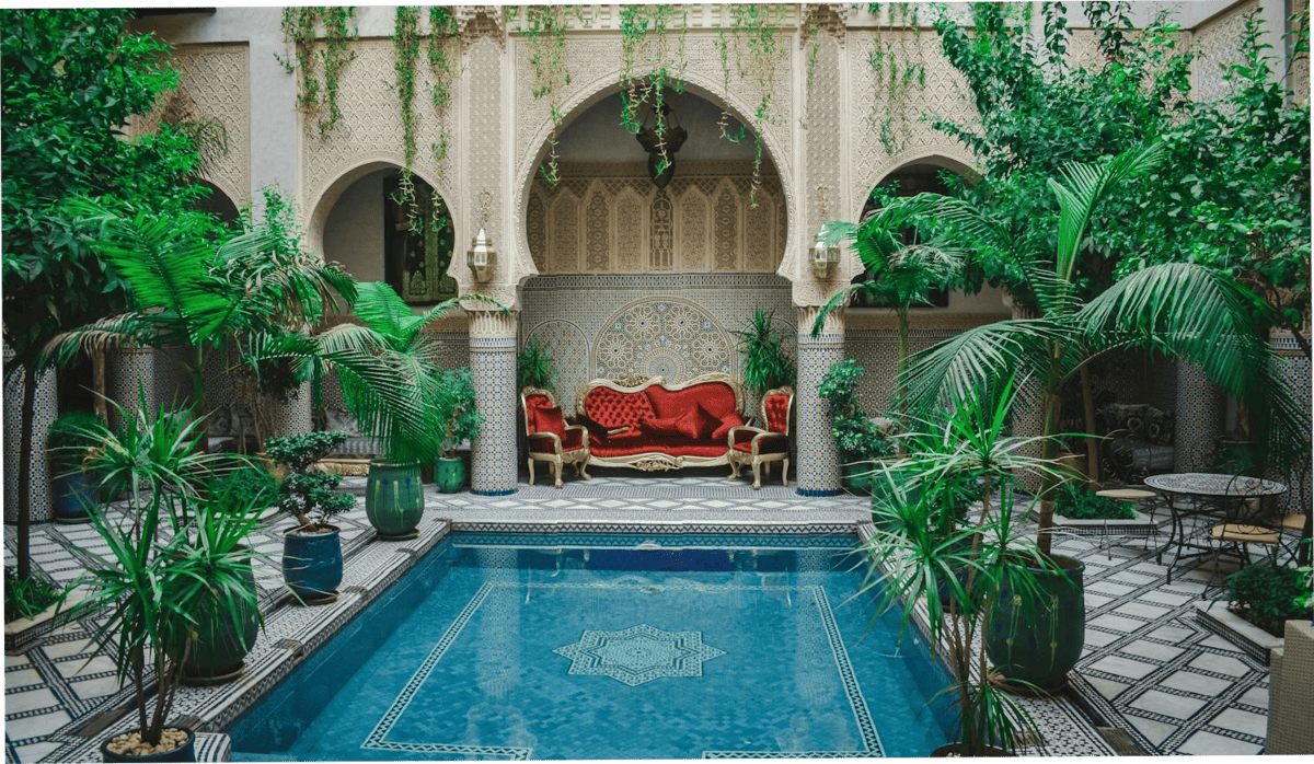 Beautiful Moroccan riad with a blue pool and a courtyard garden