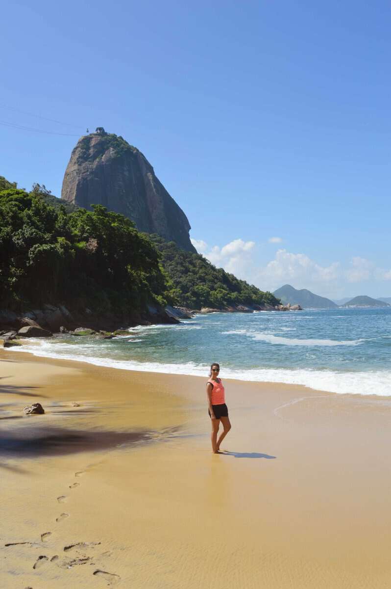 girl standing on sand in an exotic beach in rio de janeiro