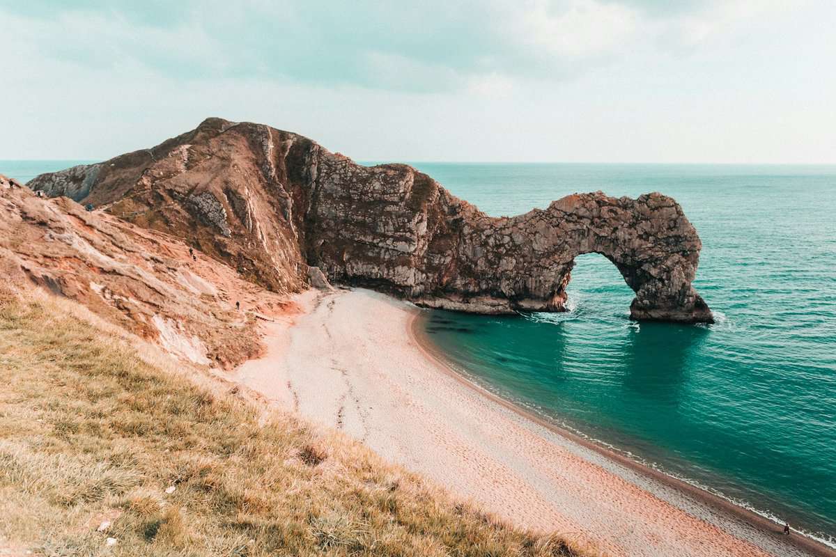 Jurassic landmark in the middle of a sandy beach