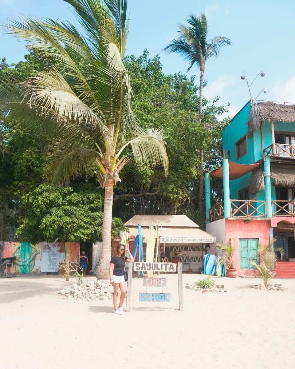 Girl next to a surf station in sayulita