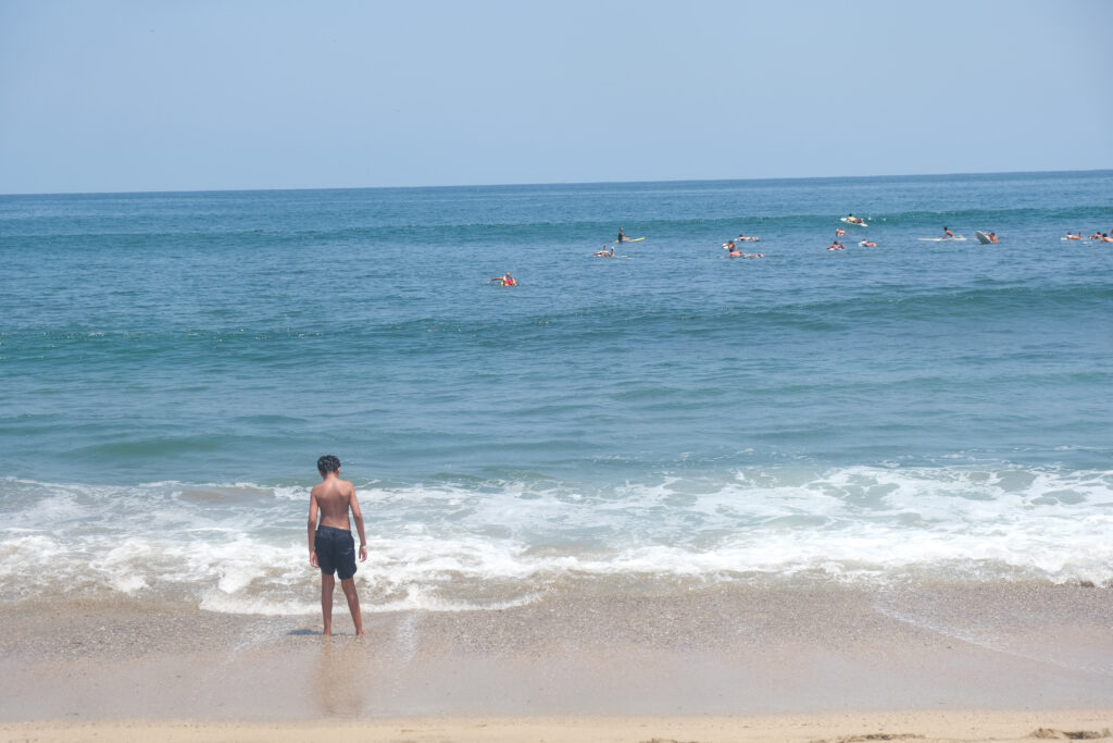 boy looking at the ocean in Sayulita