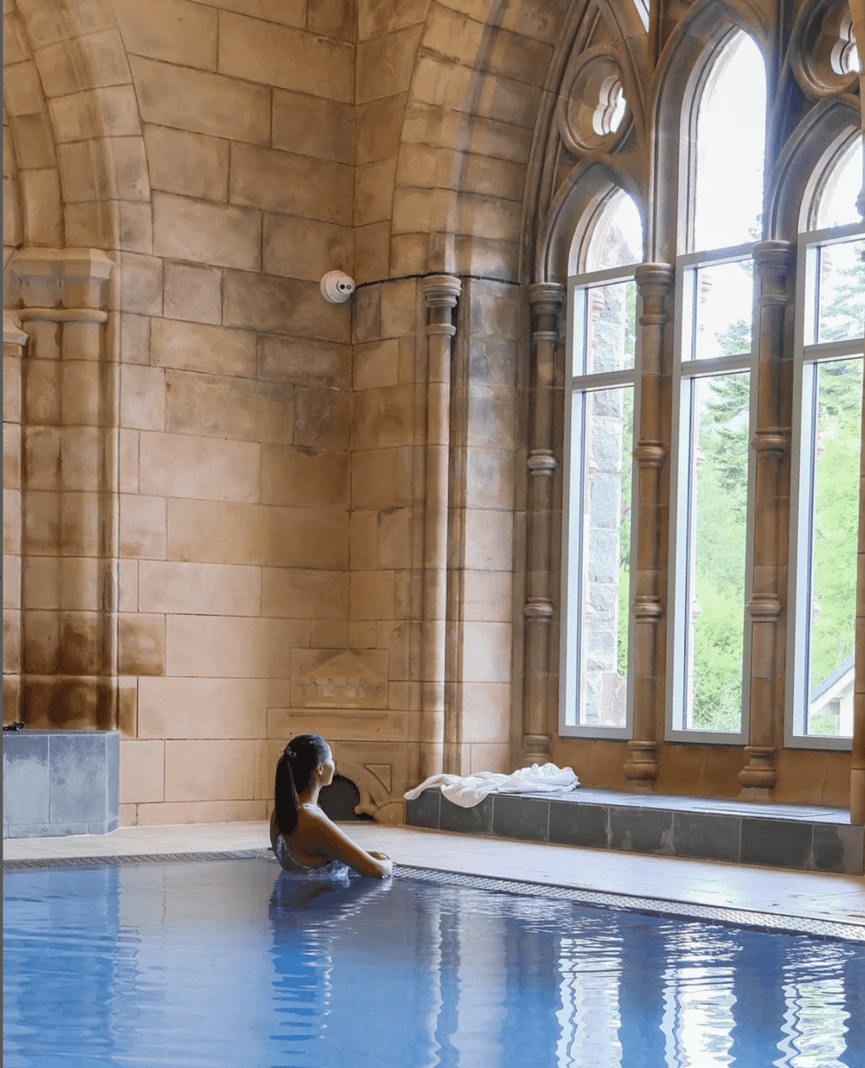 Girl at spa in old building. Luxury travel for less