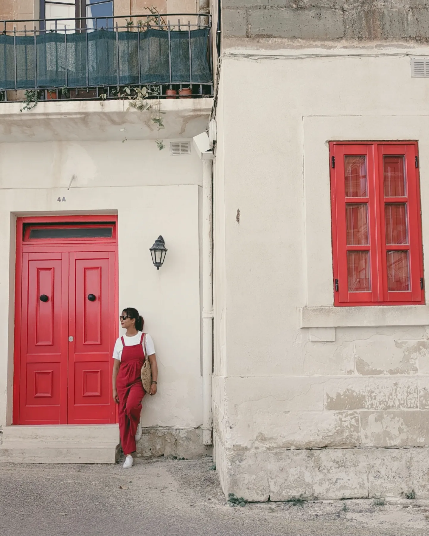 pretty house with red door and shutters